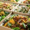 Assorted fresh salads in eco-friendly takeaway containers from The Moody Chef.