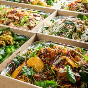 Assorted fresh salads in eco-friendly takeaway containers from The Moody Chef.