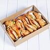 Delicious croissant sandwiches with fresh vegetables in a box.