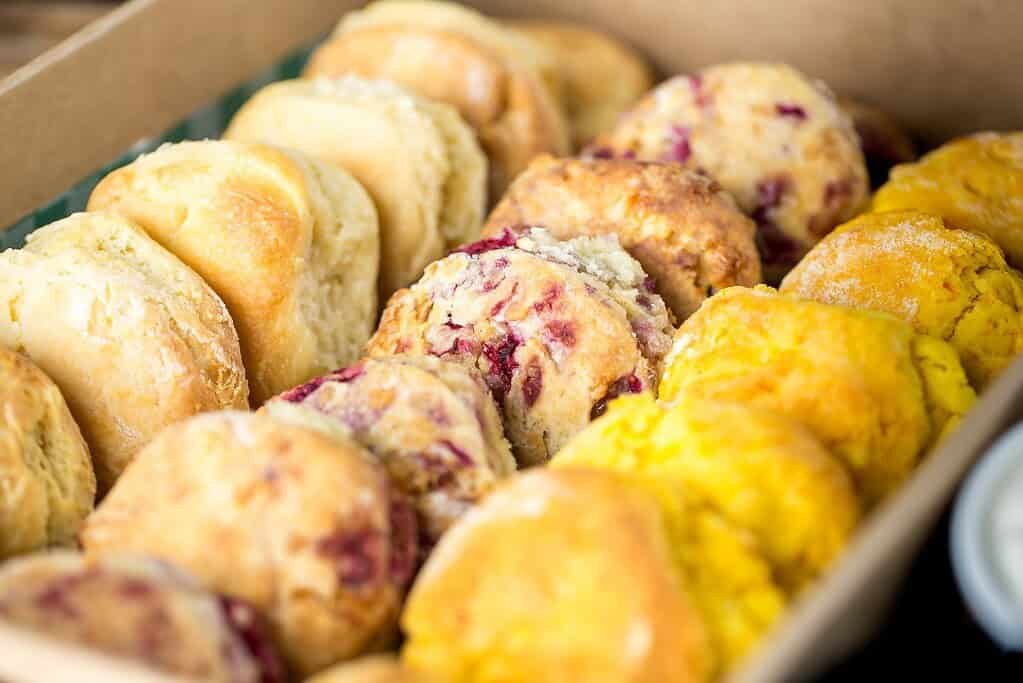 Assorted freshly baked scones with berries and lemon zest from The Moody Chef.